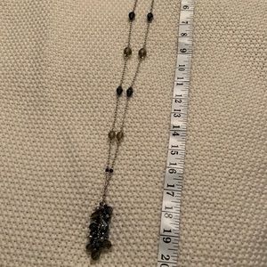 Long silver necklace with blue beads